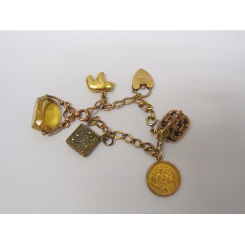 1107 - A metal charm bracelet with a 9ct gold padlock, 1906 gold half-sovereign, a 9ct gold swivel centre f... 