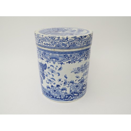 6070 - A blue and white semi-china lidded canister, hairline crack to lid, chip to base, 21.5cm tall x 18.5... 