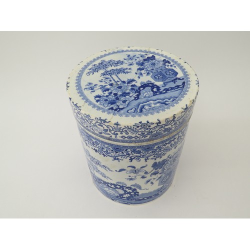 6070 - A blue and white semi-china lidded canister, hairline crack to lid, chip to base, 21.5cm tall x 18.5... 