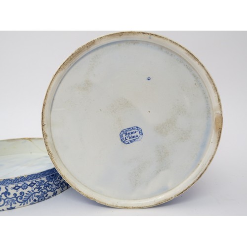 6070 - A blue and white semi-china lidded canister, hairline crack to lid, chip to base, 21.5cm tall x 18.5... 