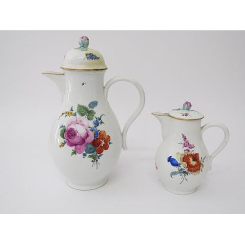 6050 - Two Meissen lidded jugs, cracks present to large example and restoration, 15cm and 26cm tall