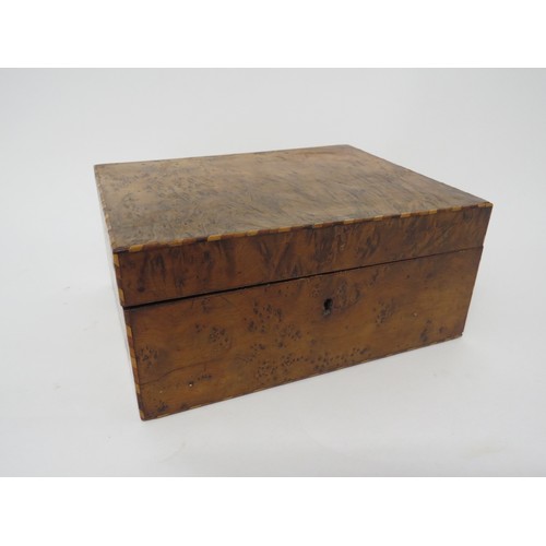 6104 - A Walnut jewellery box with compartmented tray interior and parquetry inlay, 10cm x 21.5cm x 17cm