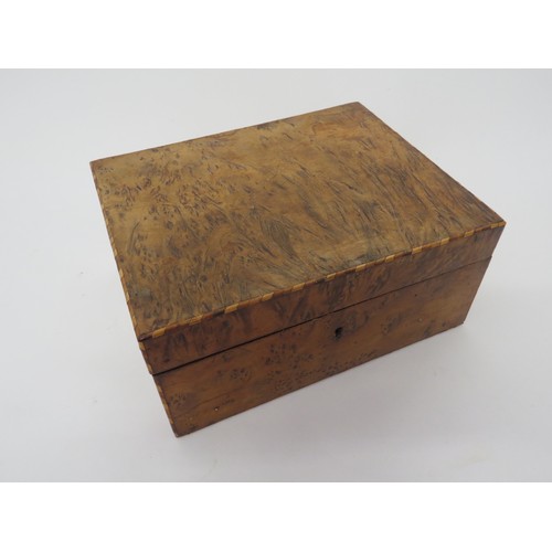 6104 - A Walnut jewellery box with compartmented tray interior and parquetry inlay, 10cm x 21.5cm x 17cm