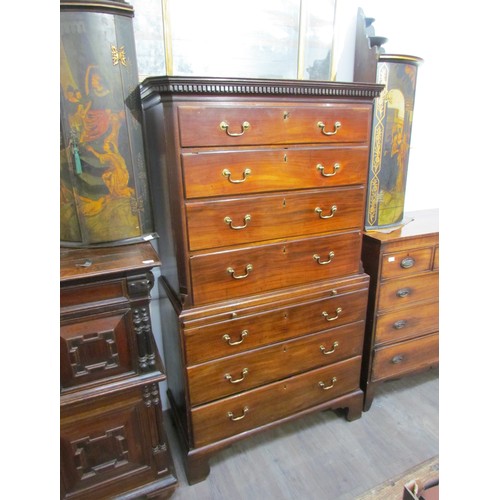 6075 - A George III mahogany chest on chest with brushing slide, areas of damage present to drawer edges,  ... 