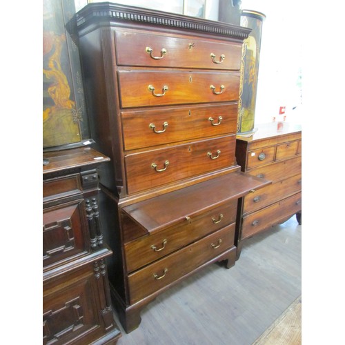 6075 - A George III mahogany chest on chest with brushing slide, areas of damage present to drawer edges,  ... 