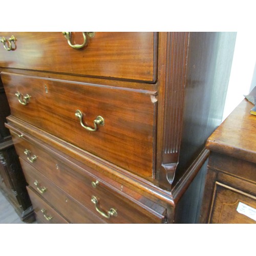 6075 - A George III mahogany chest on chest with brushing slide, areas of damage present to drawer edges,  ... 