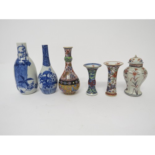 6030 - Six miniature Oriental vases of varying shapes and forms, tallest 16.5cm