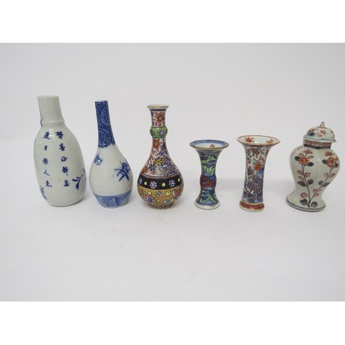 6030 - Six miniature Oriental vases of varying shapes and forms, tallest 16.5cm