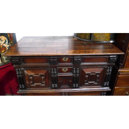 6072 - A Charles II Oak cabinet of drawers late 17th Century. The oak panelled chest over cupboard with dra... 