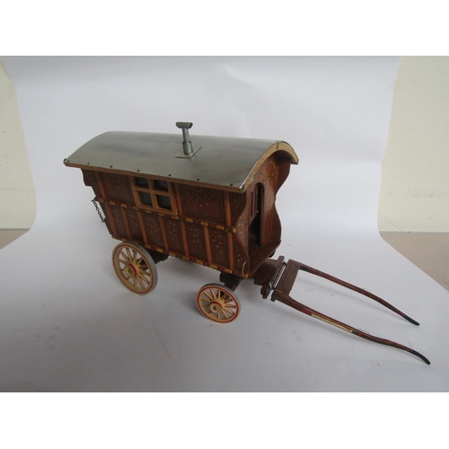 5118 - A wooden painted model of a gypsy wagon