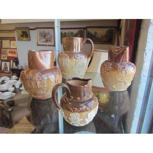 1200 - Four harvest jugs 21cm, 18cm, 17cm and 11cm tall