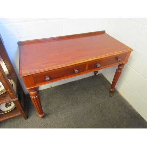 1212 - A mahogany two drawer hall table on reeded legs and ceramic castors, 75cm tall x 102cm wide x 48cm d... 