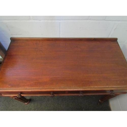 1212 - A mahogany two drawer hall table on reeded legs and ceramic castors, 75cm tall x 102cm wide x 48cm d... 