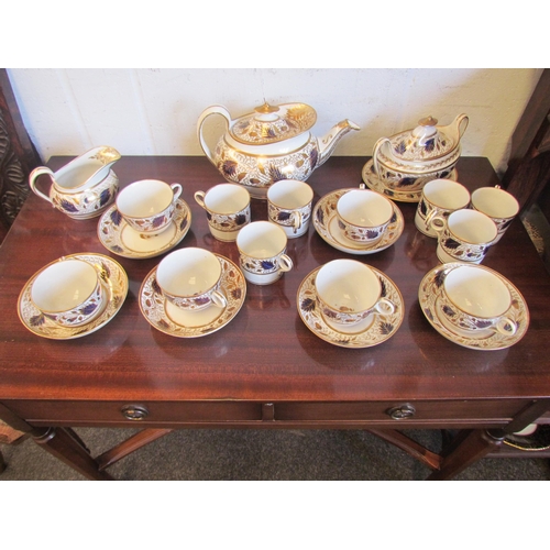 1220 - An early 19th Century English porcelain tea and coffee set, white ground with cobalt and gilt floral... 