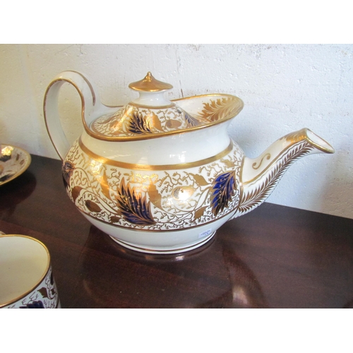 1220 - An early 19th Century English porcelain tea and coffee set, white ground with cobalt and gilt floral... 