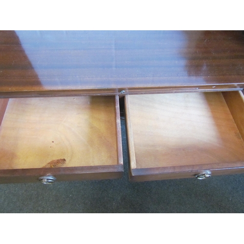 1221 - A mahogany two drawer writing table with red leather insert brushing slide on chamfered tapering leg... 