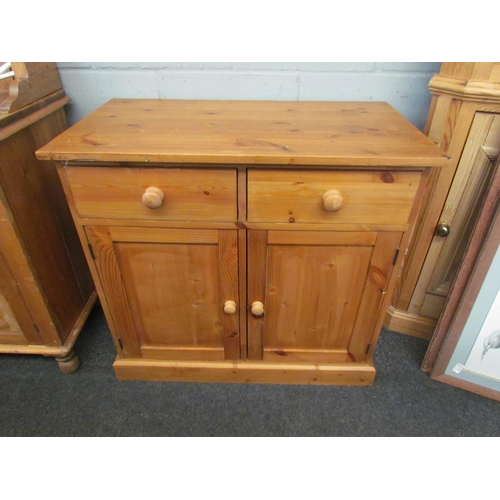 1278 - A natural pine two drawer/two door cupboard on a plinth base, 83cm tall x 90cm wide x 49cm deep