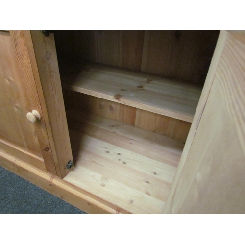 1278 - A natural pine two drawer/two door cupboard on a plinth base, 83cm tall x 90cm wide x 49cm deep