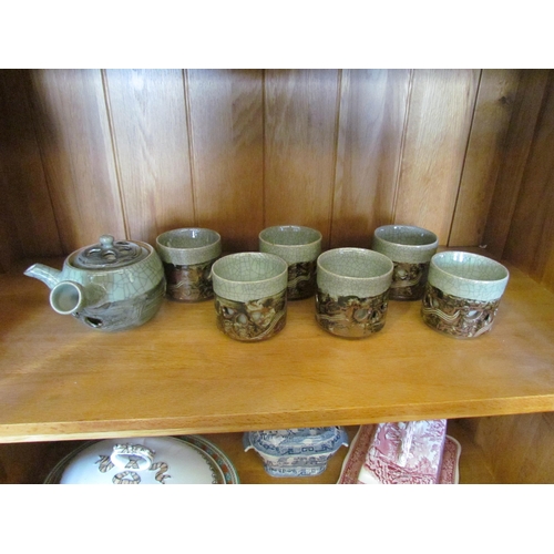 1283 - A Studio pottery tea set, crackle green glaze, pierced heart design