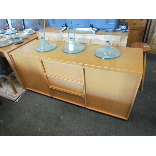 1296 - An oak veneer sideboard with three central drawers flanked by two cupboards, 73cm tall x 165cm wide ... 