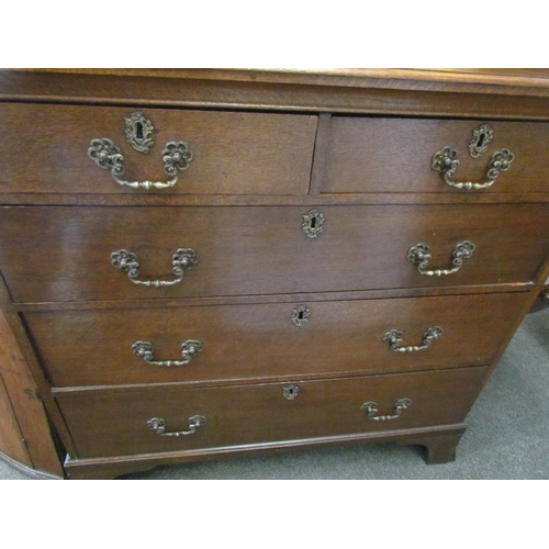 1298 - A 19th Century oak two over three graduating chest of drawers on bracket feet, 95cm tall x 98cm wide... 