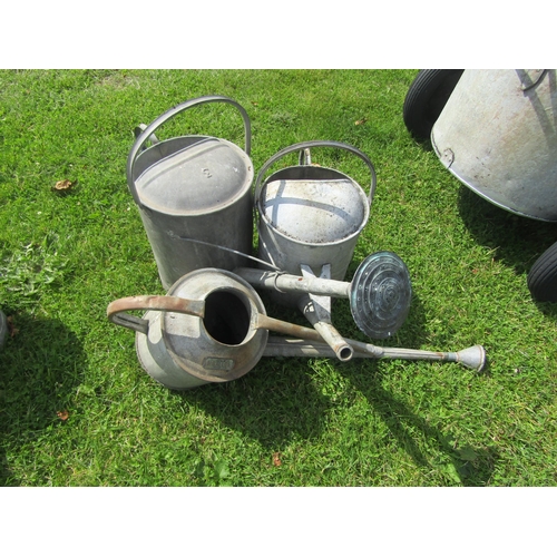 5589 - Three galvanised watering cans including long reach