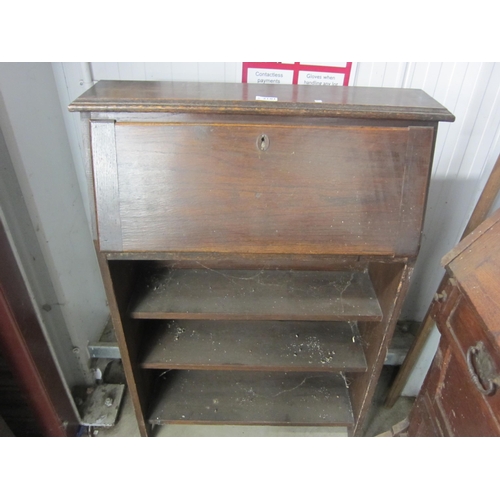 2122 - An oak students bureau and an early 20th century patented writing desk