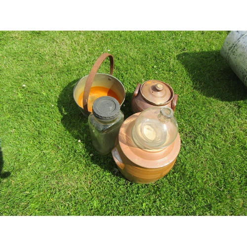 5610 - A jam pan, two stoneware lidded pots etc