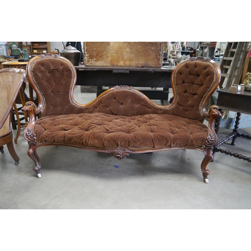 2363 - A Victorian mahogany spoon back sofa