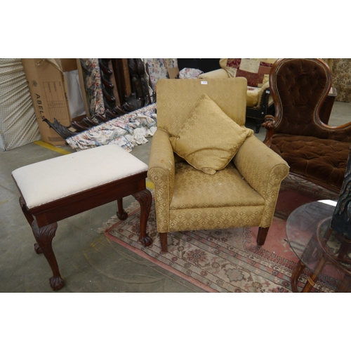 2355 - An Edwardian upholsterd armchair and a Georgian style dressing stool of rectangular form on carved c... 