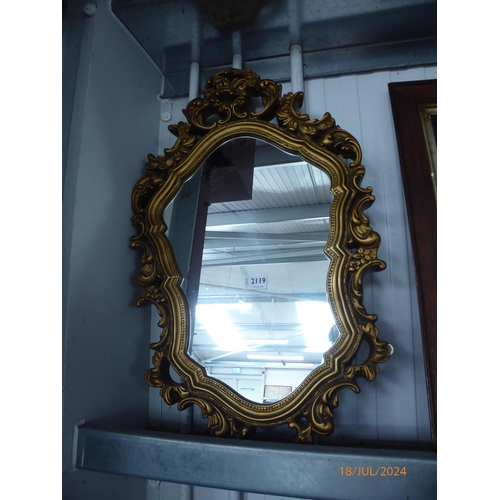 2119 - An ornate plaster gilt framed mirror