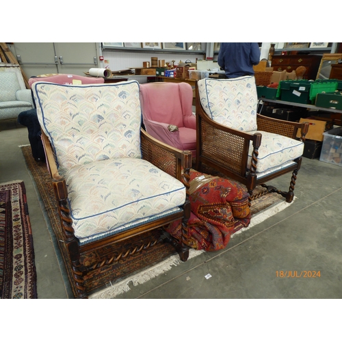 2386 - A pair of 1920's oak Bergere arm chairs with Barley twist supports