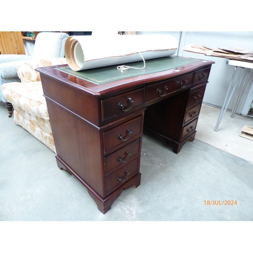 2389 - A reproduction twin pedestal desk, bow front top, tooled leather writing surface