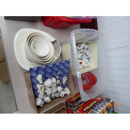 2397 - A box of ceramic mixing bowls, crested ware, etc