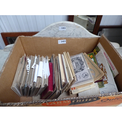 2403 - A box of postcards and ephemera