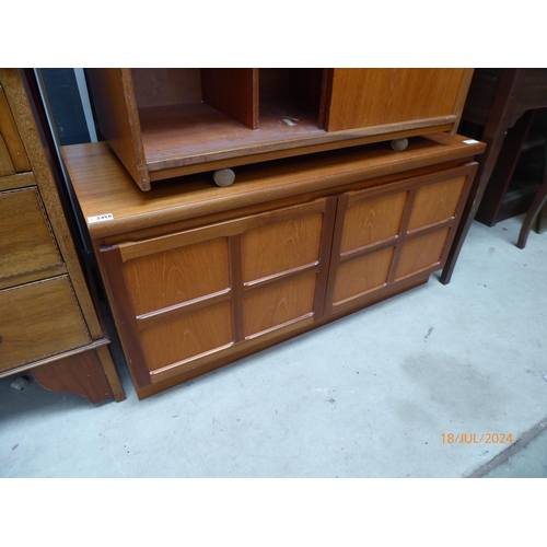 2458 - A mid century teak record cabinet, two doors