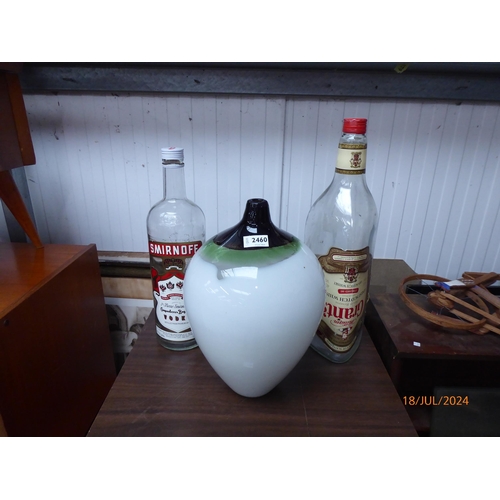 2460 - An art glas vase, a 3 ltr Smirnoff bottle and a Grants whiskey bottle