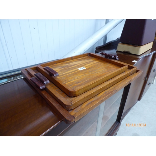 2466 - A set of graduating art deco butlers trays with bakelite handles