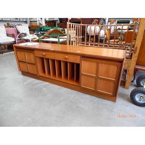 2476 - A mid century Nathan teak sideboard with two drawers over central record space flanked by twin cupbo... 