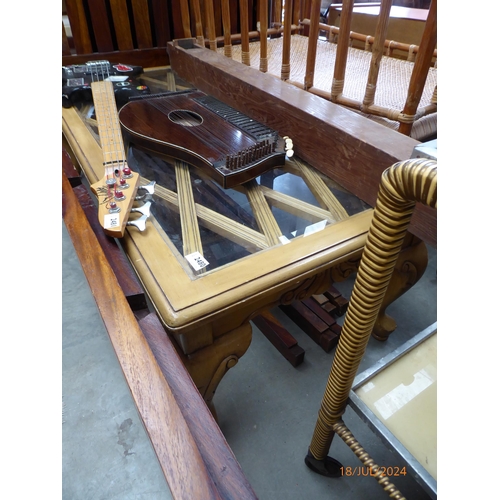 2480 - A glass top coffee table     (E) £8-12