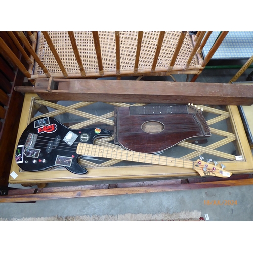 2481 - A guitar,  organ pipe and Zither