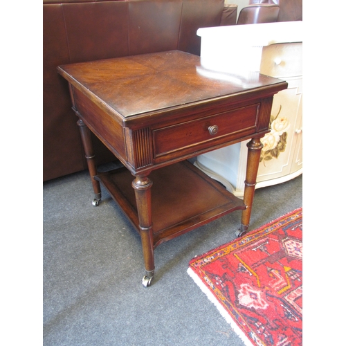 1336 - A Georgian style mahogany two tier lamp table the single drawer over brass cup castors, 66cm tall x ... 