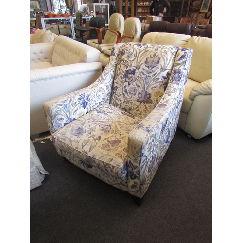 1349 - A Multiyork armchair with floral and bird upholstery, some signs of wear