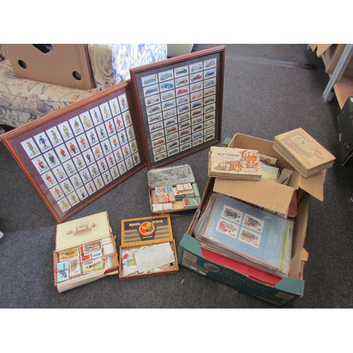 1365 - A box containing cigarette cards, loose stamps and books and two framed cigarette cards