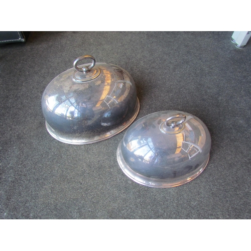 1427 - Two silver plated graduated cloches