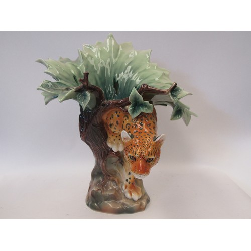 1027 - A Franz porcelein wildlife vase as a jaguar emerging from a tree. Height: 36cm. With original packag... 