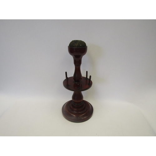 1653 - A Victorian mahogany turned wood cotton reel holder and pin cushion, 32cm tall