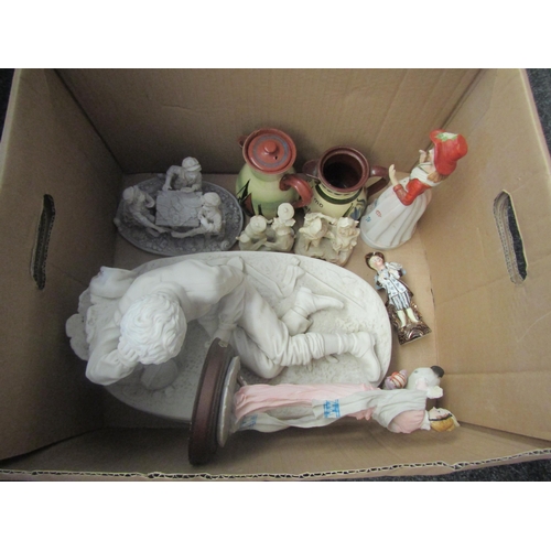 1670 - Two boxes containing ceramics including figure of a WWII soldier reclining, a pair of honey pots, a ... 