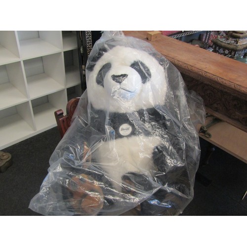 1023 - A large Steiff PUMMY PANDA soft toy No 075803, sealed in original bag. Gold-coloured button and yell... 