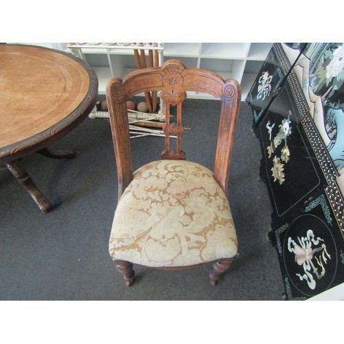 1029 - A Victorian barrel-backed salon chair, with tapestry overstuffed seat, and fluted ring-turned front ... 